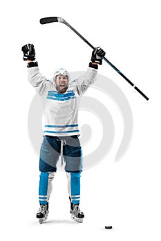 Very emotional hockey player with stick in his hands. Sports emotions. Athlete in action. Hockey champion with desire to