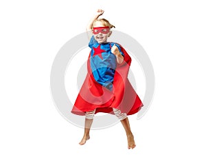 Very excited little girl dressed like superhero jumping isolated on white background.