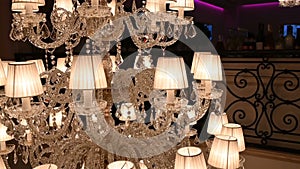 A very expensive chandelier in a chic restaurant or concert hall. Concept of luxury life.