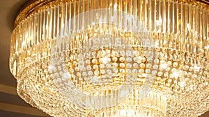 A very expensive chandelier in a chic restaurant or concert hall. Concept of luxury life. The video is suitable for the