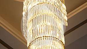 A very expensive chandelier in a chic restaurant or concert hall. Concept of luxury life. The video is suitable for the