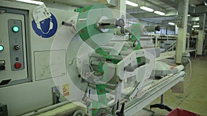 Very fast lollipop packing machine in candy factory