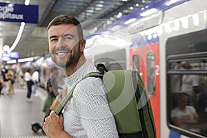 Very good looking man taking the subway