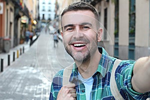 Very handsome man taking selfie