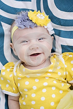 Very Happy infant smiling at camera