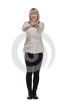 very happy woman scattering a bundle of dollar bills.