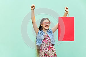 Very happyness beautiful long-haired girl in casual clothing with shopping bags, looking at camera. Caucasian blondie model.