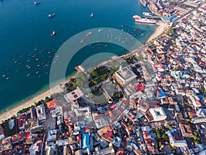 Very High Above Aerial Top View Shot of Stone Town, the Capital of Zanzibar, Tanzania. Sunset Time Coastal City in