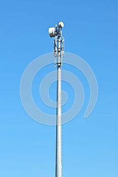 Very high Telecommunication tower with blue sky