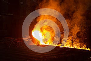 Very hot metal casting in a old steel factory