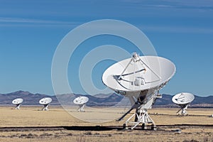 Very Large Array arrangement of radio telescope dishes in the desert, winter, science and technology