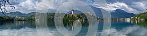 Very large panoramic view on The Church of Mary the Queen, located on an island in Lake Bled. Slovenia