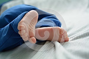 Very little newborn baby foot