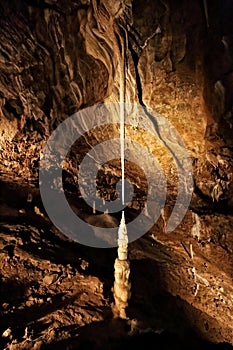 Very long and narrow stalagmite and stalactite