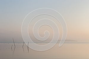 A very minimalistic view of a Trasimeno lake at dawn, with soft