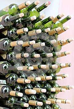 Very much stacked up wine bottles with corks