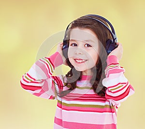 Very musical little girl listening to music