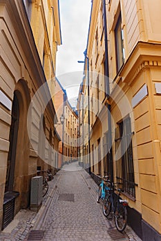 Very narrow street between the yellow houses. Stockholm, swedish vacation