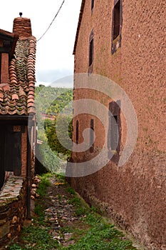 Very Narrow Streets Of A Quaint Village With Its Black Slate Roofs In Madriguera. Architecture Vacation Travel Rural Life. photo