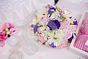 A very nicely decorated wedding table with plates and serviettes