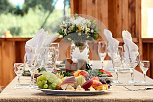 Very nicely decorated wedding table with plates and serviettes.