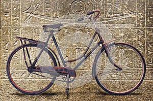 A very old bicycle inside an egyptian tomb