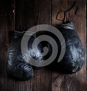 Very old black boxing gloves