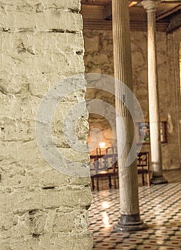 Very Old church with pillars and beautiful rock walls and file floors inside photo