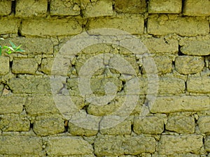 Very old clay brickwork wall background. Cracked brickwork.