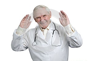 Very old doctor laughing raising hands up.