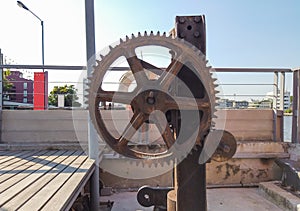 Very old factory gear, antique factory machinery with cogged wheels that rust