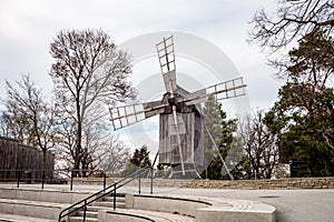 Very old grey wooden wind mill in open-air museum Skansen, Stockholm