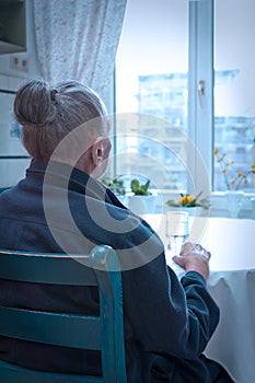 Very old lonely woman window