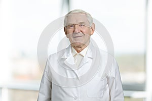 Very old man in white uniform.