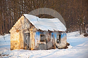 Very Old and ruined house in winter scenery