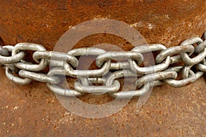 A very old rustic rusted metal surface and chains