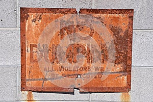 Old rusty NO DUMPING sign