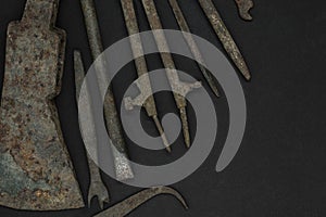 Very Old and Rusty Tools on Black Background with Free Space