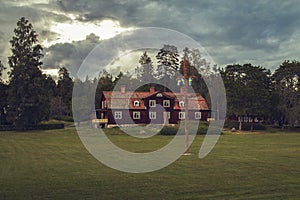 Very old Swedish house with a garden inside the forest.