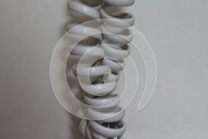 Very old telephone cable that can stretch wrap photo