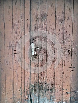 Very old wooden and weathered brown front door