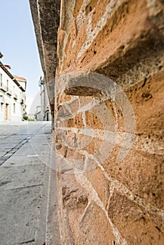 Very old and worn clay bricks on a wall in a Vintag