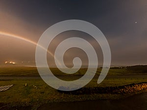 Very rare moonbow during the night above Staffin bay