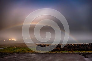 Very rare moonbow during the night above Staffin bay - Isle of Skye, Scotland