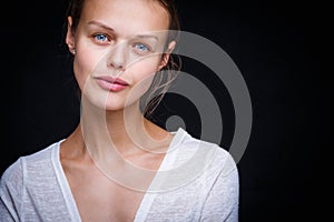 Very retty young woman's simple studio portrait