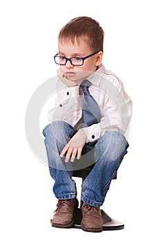 Very sad clever kid on white