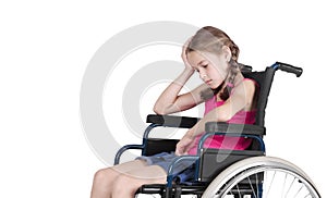 Very sad handicapped girl in a wheelchair