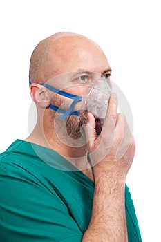 Very Sick Man Doing Inhalation Through Oxygen Mask At Hospital, isolated on white