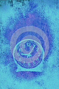 A very simple round blue clock against empty ethereal  background