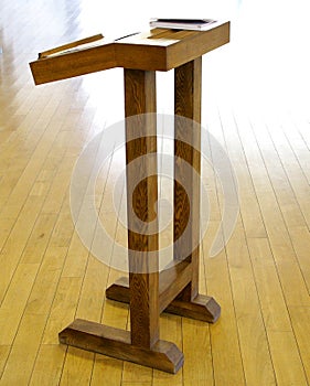 Very simple wooden cathedra tribune for lecture